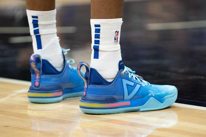 View of Andrew Wiggins' blue and pink shoes.